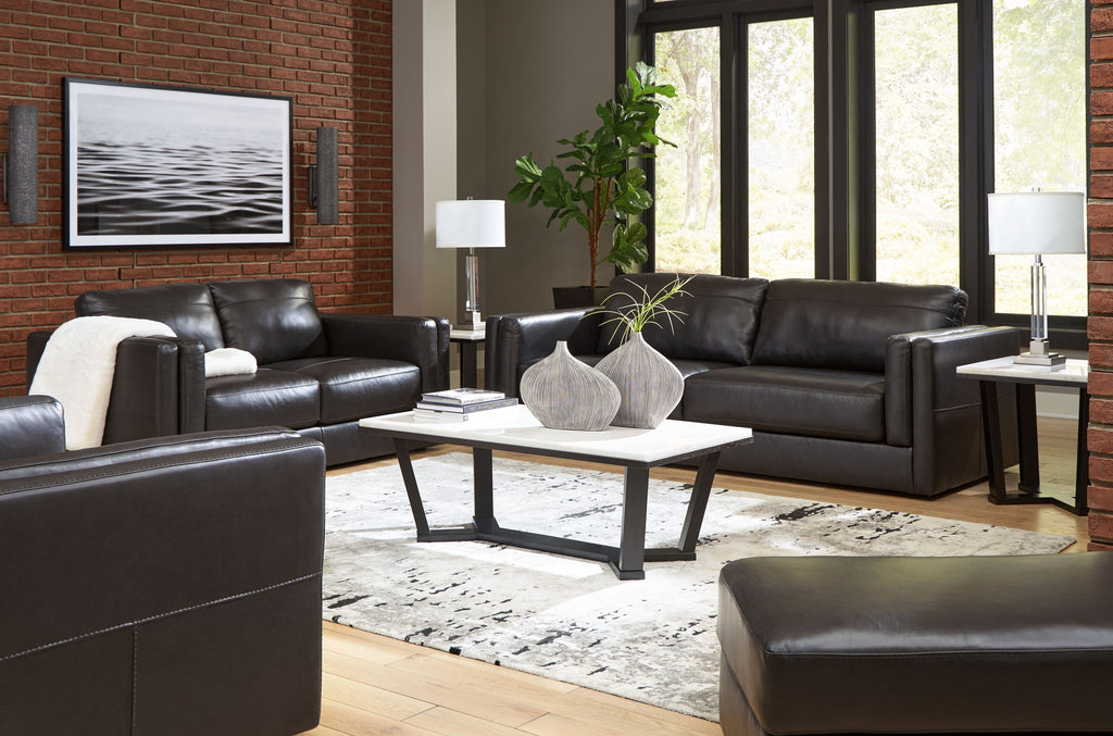 Black leather living room seating set with sofa, loveseat, and chair
