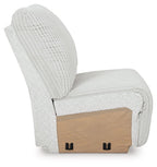 Armless chair side view with ribbed light gray upholstery, tan base panel, black feet