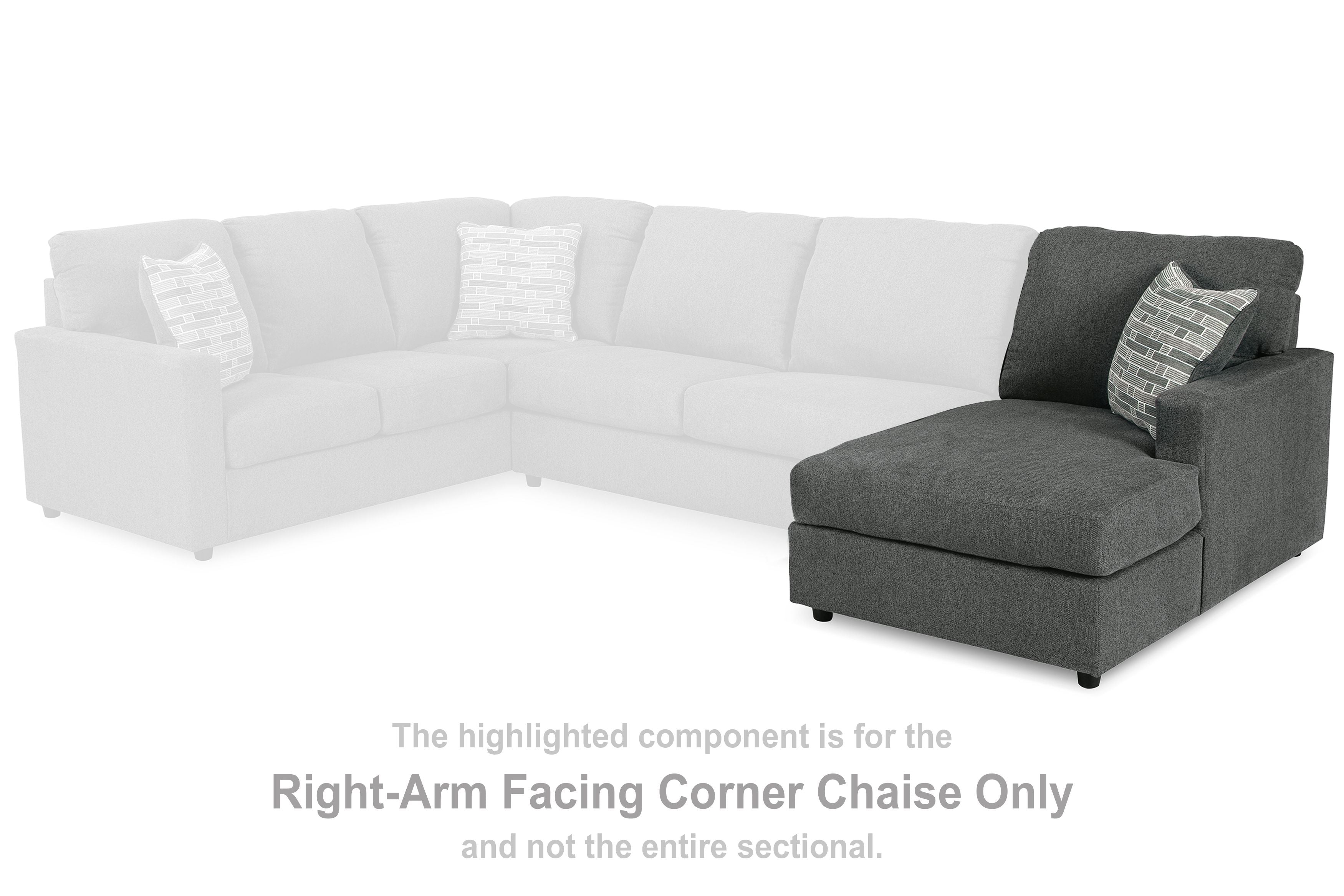 Sectional corner chaise with dark gray ottoman and patterned throw pillow
