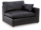 Black RAF corner chair, single seat with backrest and matching throw pillow, vinyl