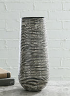 Tall ceramic vase in dark gray with light wave-etched lines, cylindrical silhouette.