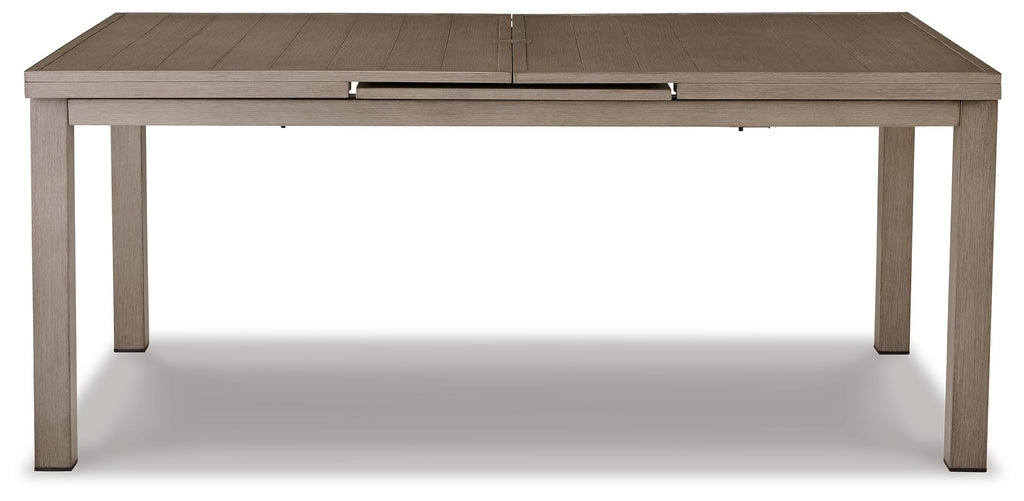 Rectangular outdoor dining table with beige top and metal corner latches