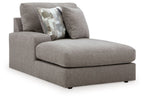Smoke gray upholstered corner chaise with seat, back cushions, and patterned throw pillow
