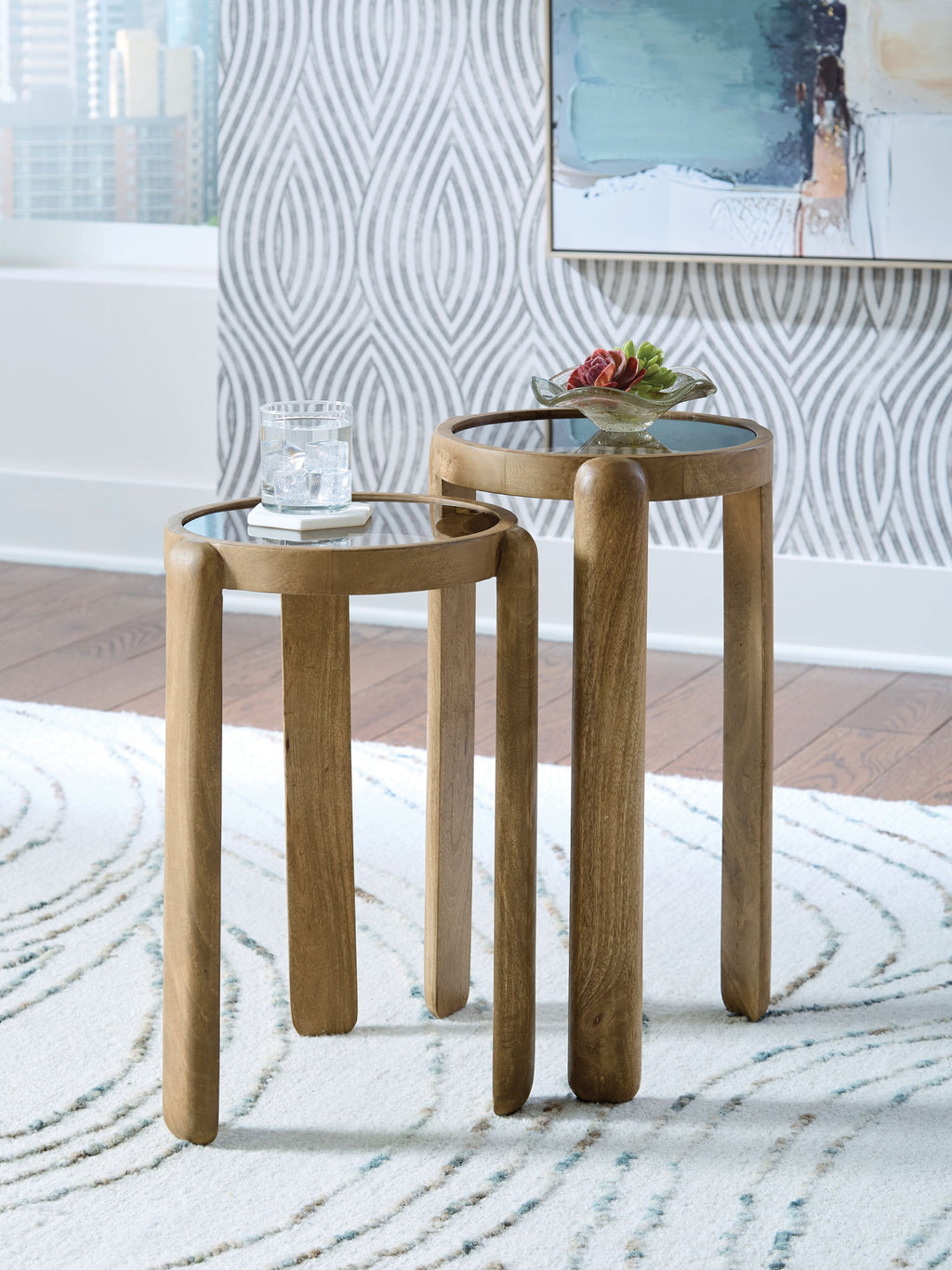Set of 2 light brown round accent tables with tapered legs, nested