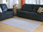 Gray washable rug with textured stripe pattern, centered on hardwood floor