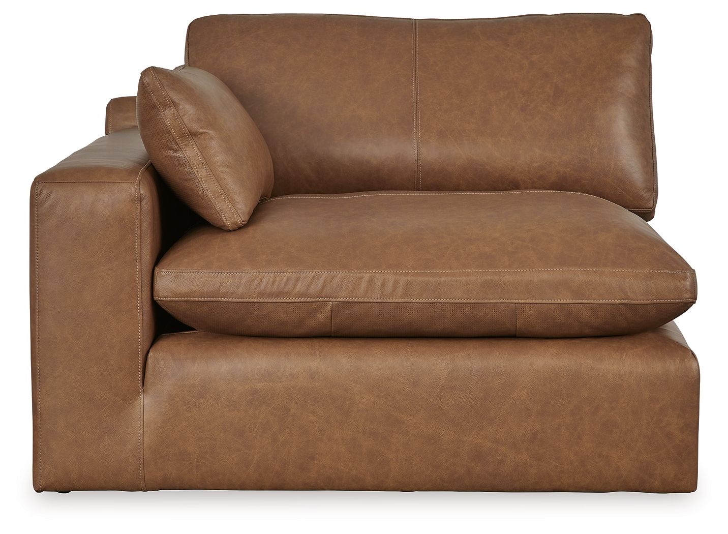 Caramel brown armchair corner with tall backrest and thick seat cushion, side view.