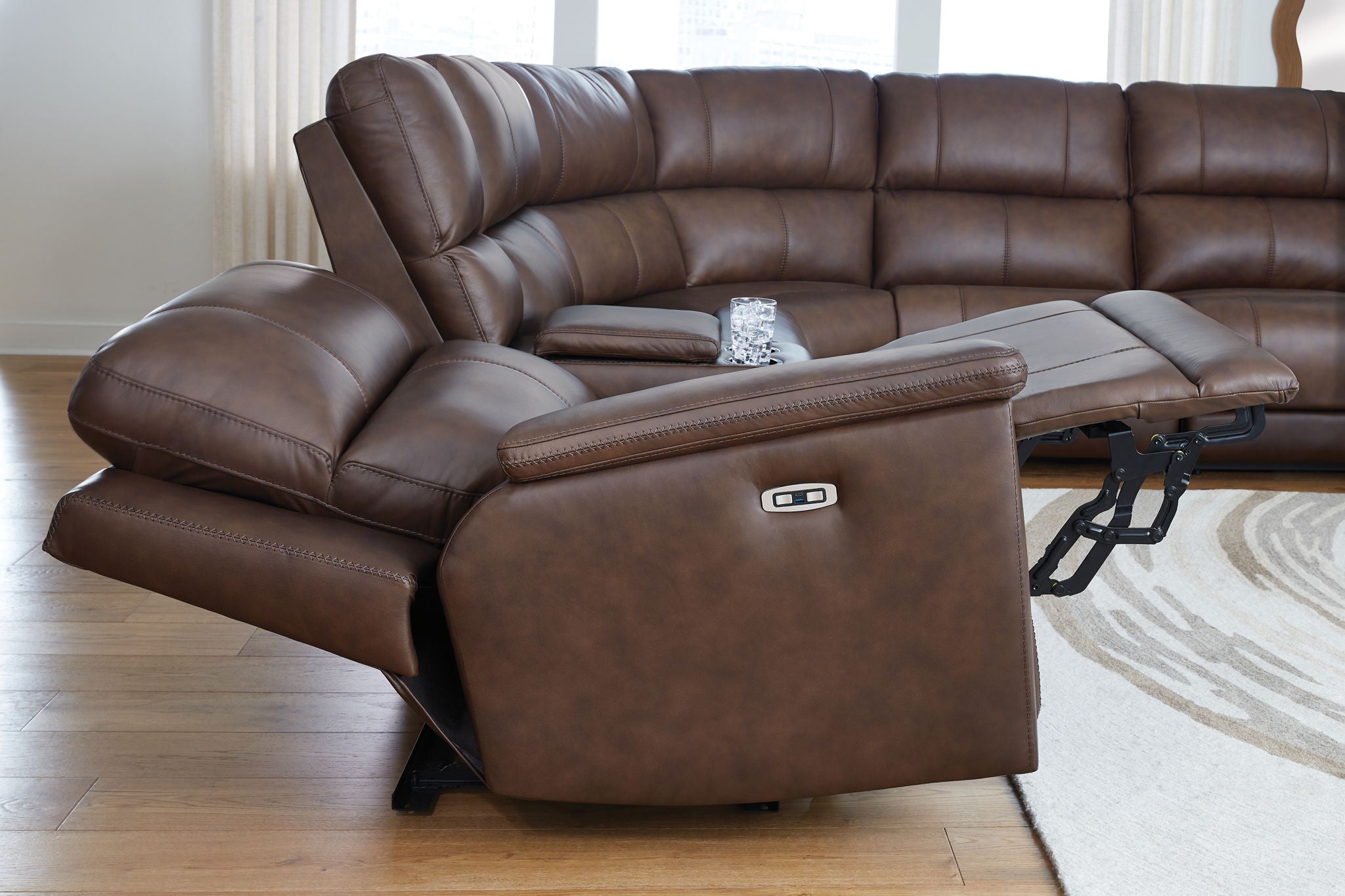 Brown reclining sectional chaise with power control and padded arm