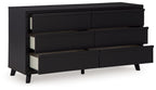 Black panel dresser showing open drawer fronts and interior rails