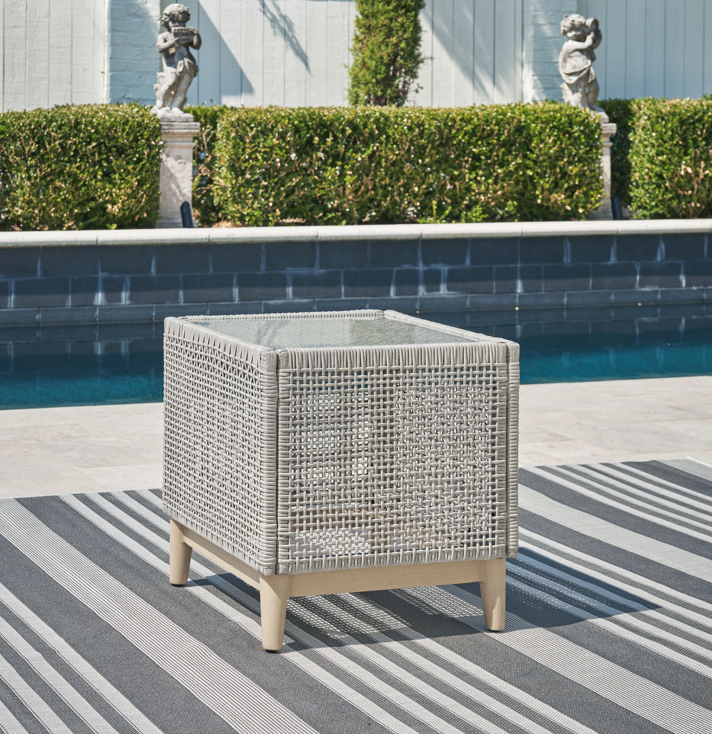 Gray wicker square end table with open weave design and tapered wood feet
