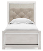 White panel bed with light gray upholstered headboard and one footboard drawer.