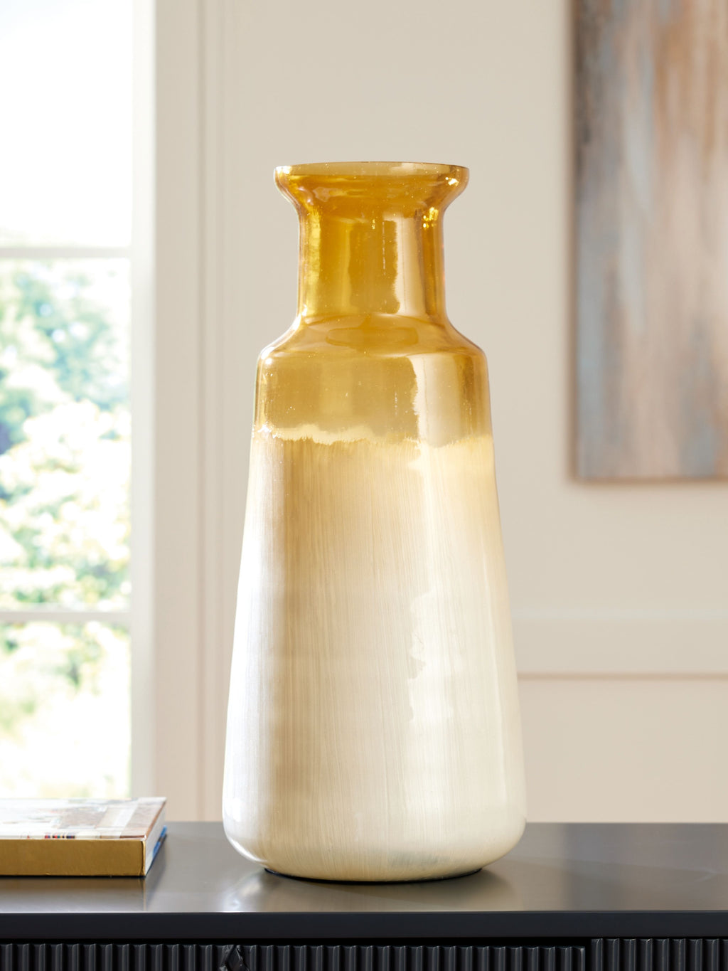 Ivory ceramic vase with amber top, rounded shoulders, and narrow neck