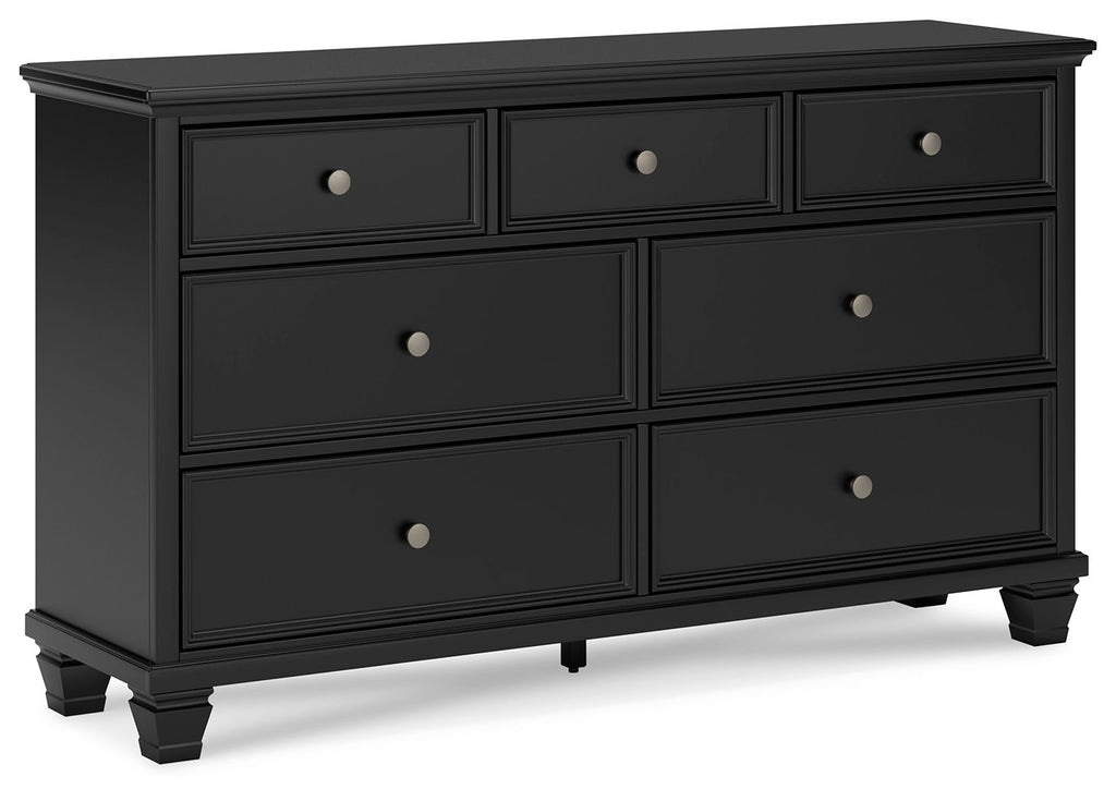 Black dresser with six drawers and round silver knobs, flat front panels, short legs
