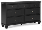 Black dresser with six drawers and round silver knobs, flat front panels, short legs