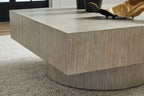 Light brown square table corner view with round pedestal base