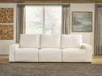 White power reclining sectional sofa with three front seat panels and cushioned back