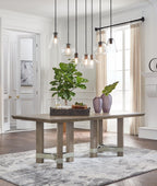 Gray rectangular dining table with central pedestal base and four legs