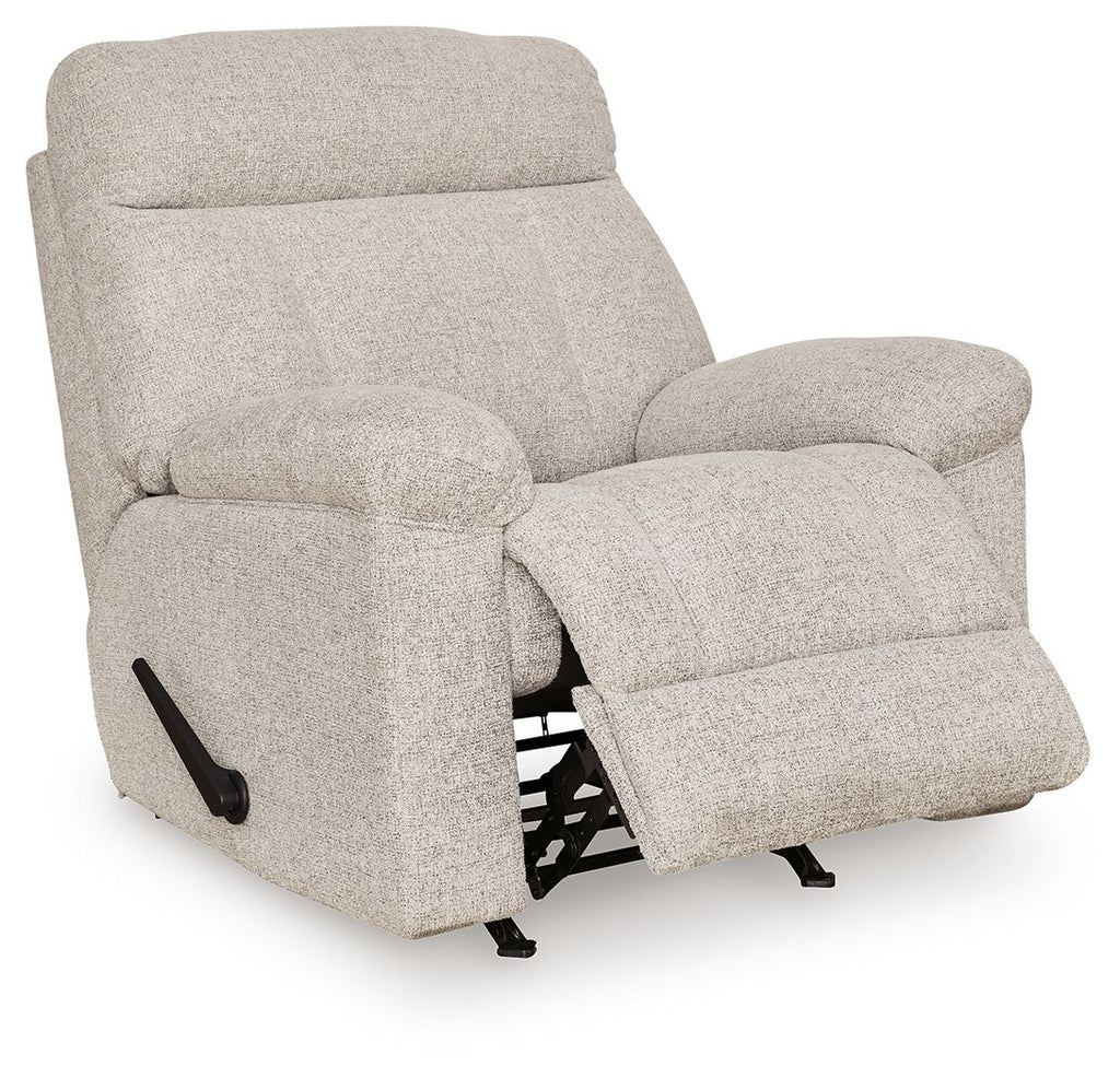 Rocker recliner chair in light gray fabric, side view with extended footrest