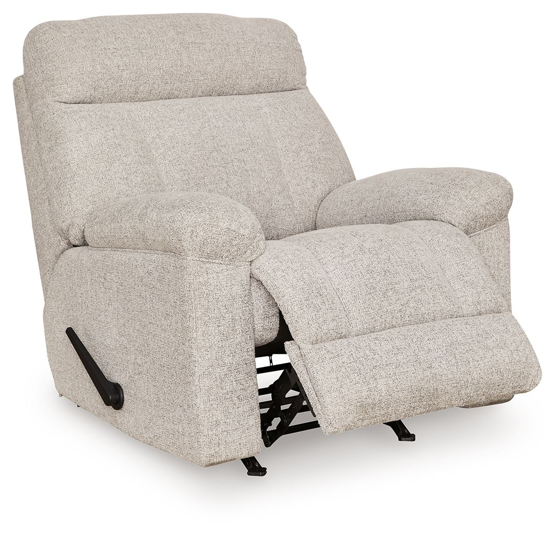 Rocker recliner chair in light gray fabric, side view with extended footrest