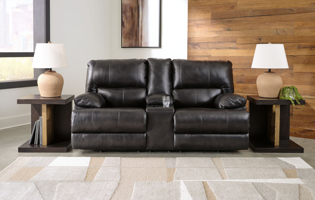 Dark leather-look power reclining loveseat with console and adjustable headrests, side view