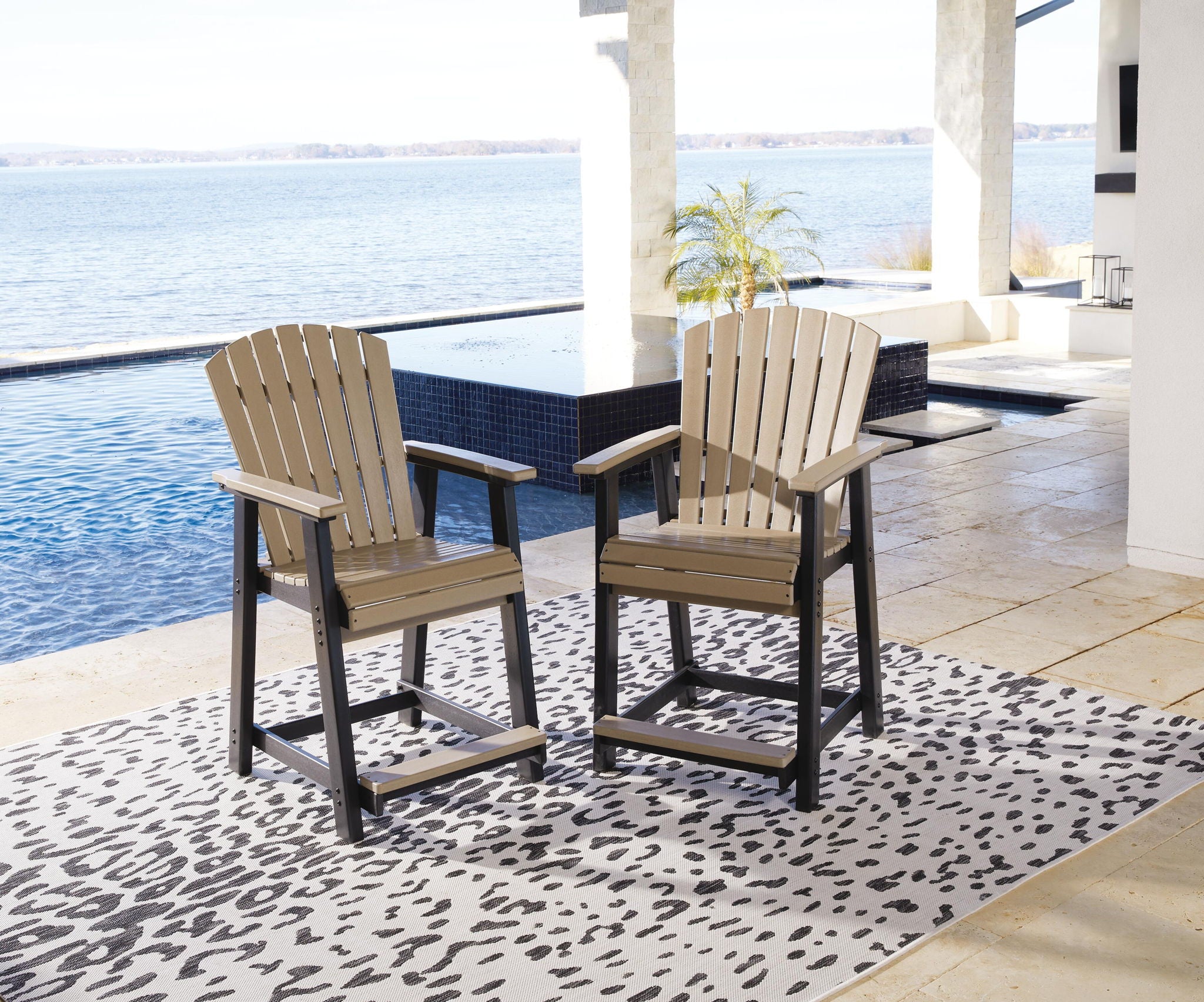 Outdoor barstool set of 2 with slatted backs, beige cushions, black legs and footrests