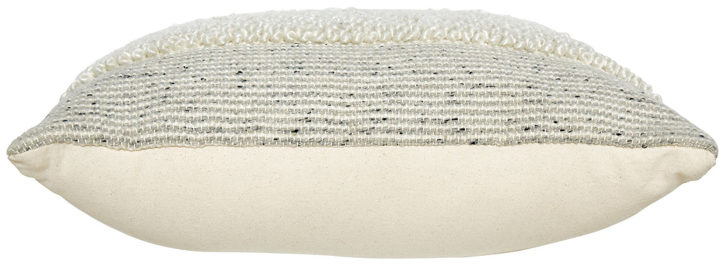 Textured cream pillow with piped edge and rounded seam profile