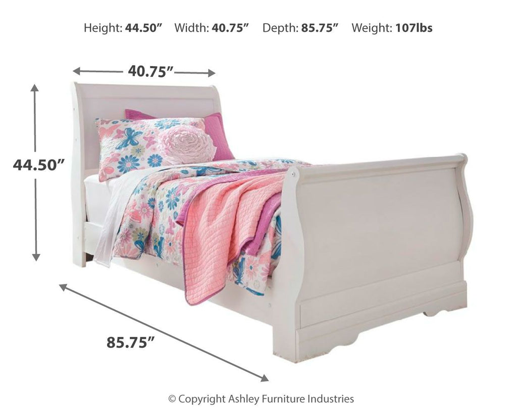 White sleigh bed with rounded footboard and headboard, shown with pink and floral bedding.