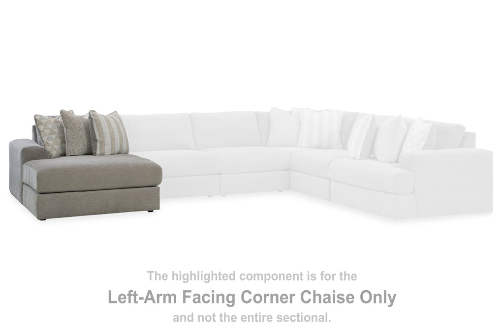 White corner chaise sectional with gray side and several back cushions