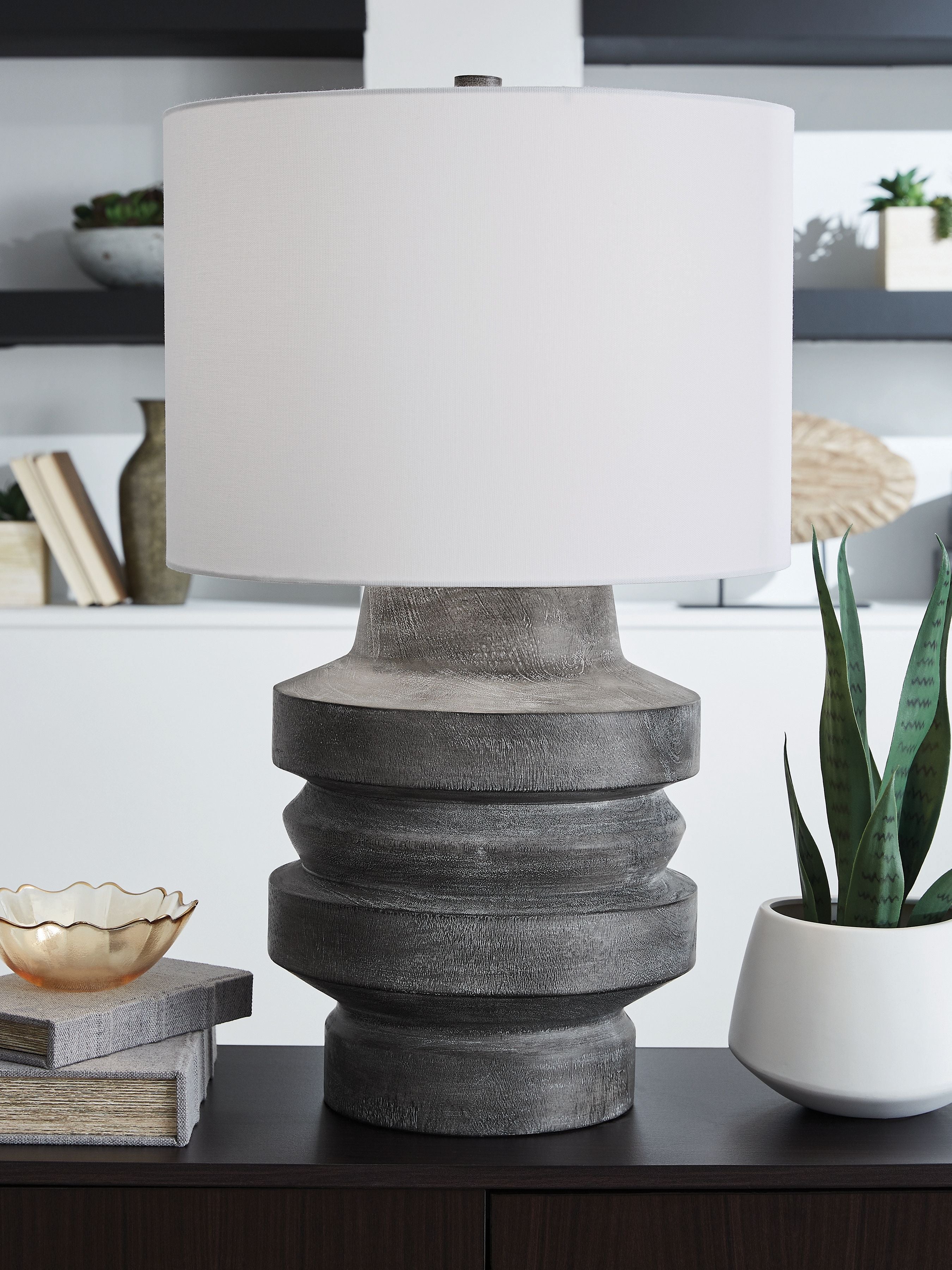 Distressed black poly table lamp with white drum shade and ribbed base