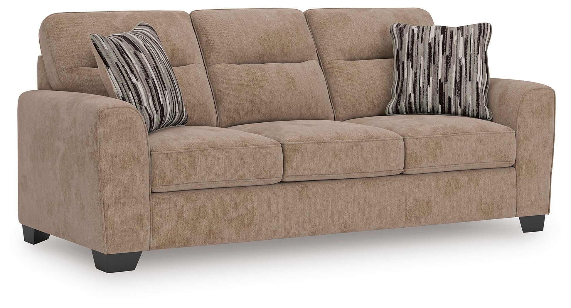 Light brown sofa with three seat cushions and two striped lumbar pillows