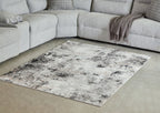 Black and gray distressed abstract area rug with wide border