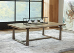Gray rectangular cocktail table with dark metal frame and raised top for serving