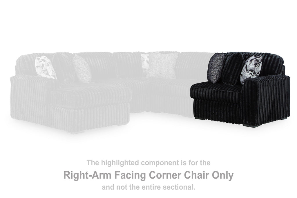 Onyx right-arm corner accent chair with ribbed corduroy and patterned throw pillow