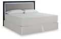 Light gray upholstered panel headboard with dark frame and open textured back panel.