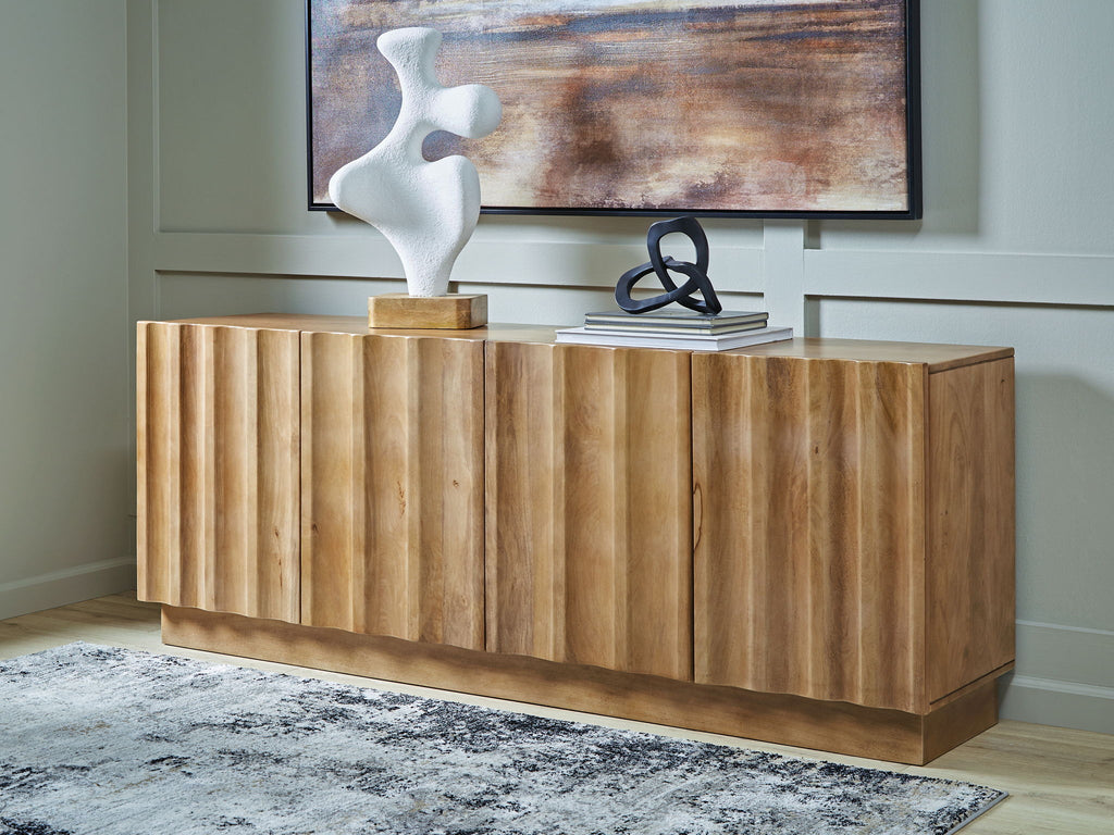 Accent cabinet with fluted front panels, whitewashed wood finish, low sideboard