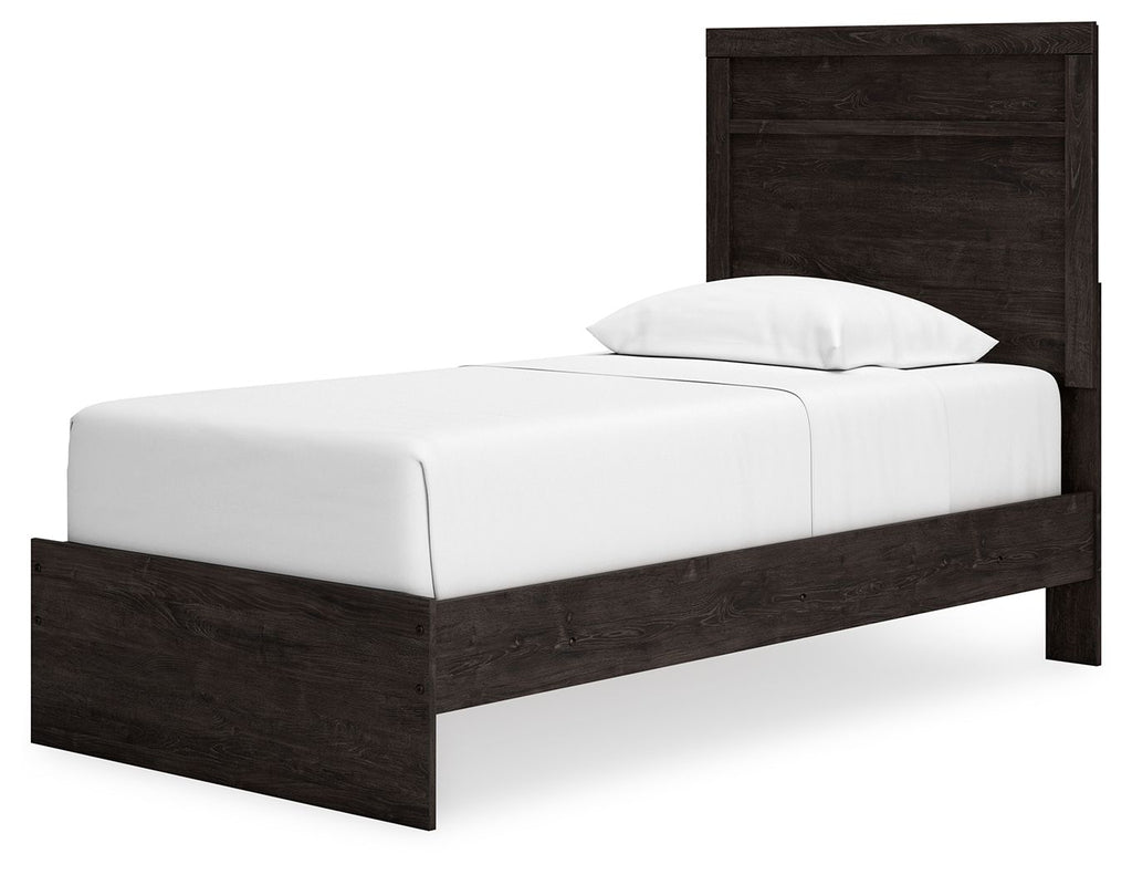 Panel bed with dark wood headboard and footboard, white mattress with pillow