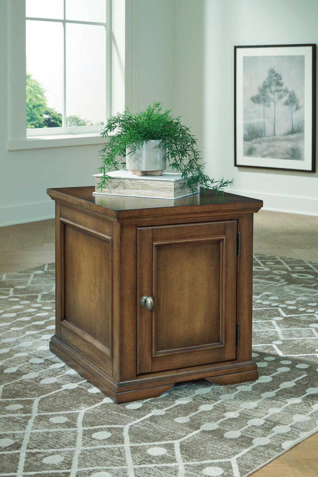 Dark brown wood end table with cabinet door and lower drawers