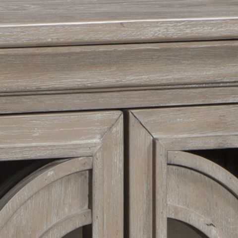 Gray accent cabinet door frame close-up with carved panel detail
