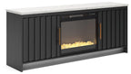 Black TV stand with faux firebrick fireplace insert, yellow flame effect behind glass