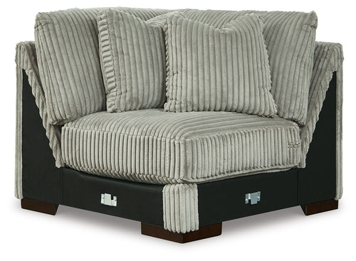 Light gray wedge sofa with ribbed fabric, rolled arms, and tufted back cushions