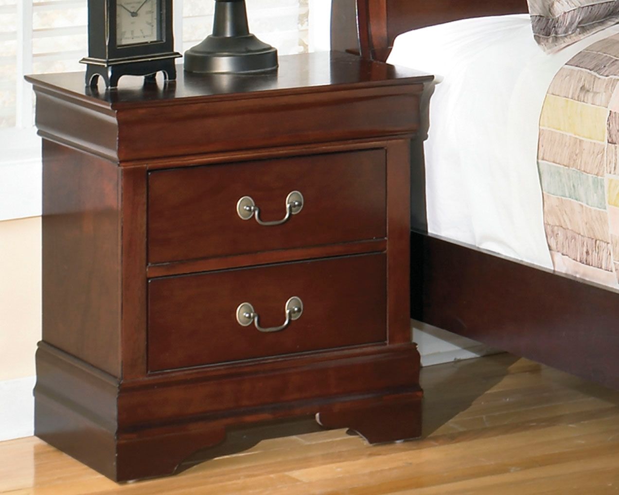 Reddish brown two-drawer nightstand with two curved metal handles