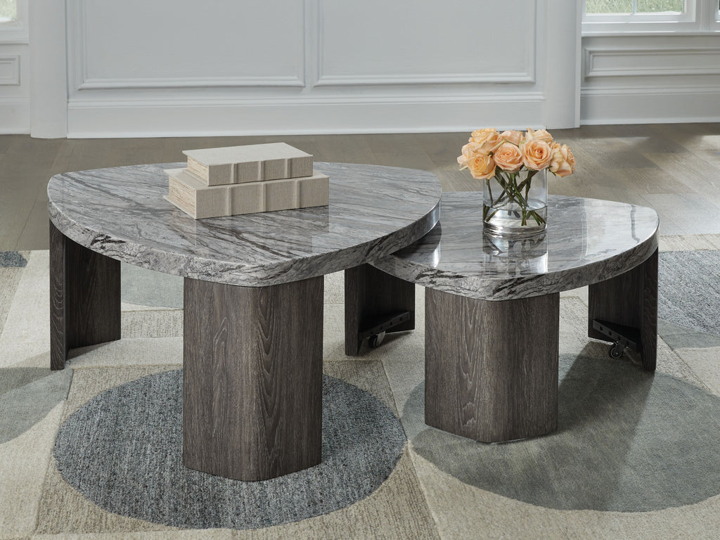 Pair of round nesting cocktail tables with gray marbled tops and thick gray pedestal bases