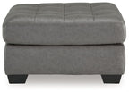 Oversized accent ottoman in gray with stitched panels and square black legs