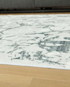 Washable rug, beige with distressed marble pattern in gray and muted green