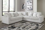 Gray sectional sofa with oversized chaise, tufted back pillows and ribbed texture