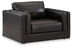 Black leather armchair with wide track arms and padded seat