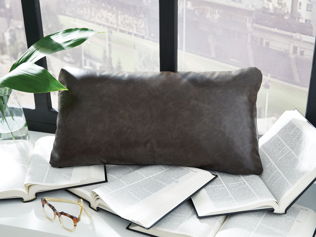 Dark charcoal rectangular pillow with smooth fabric surface