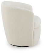 Swivel accent chair in light cream velvet with rounded back and supportive seat.