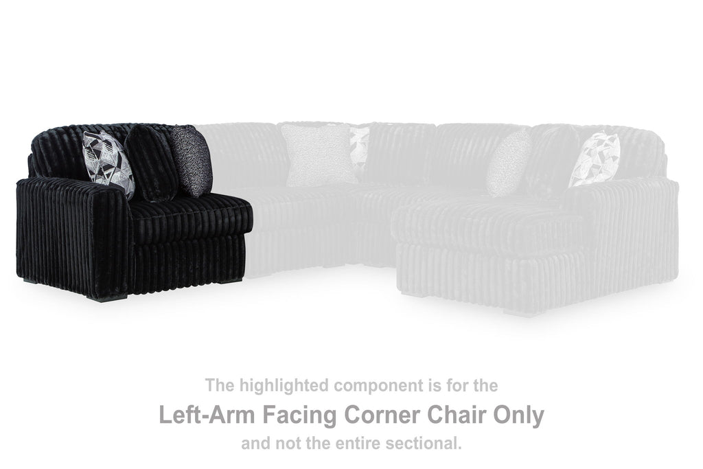 Black corduroy LAF corner chair section with thick armrests and tufted back cushion