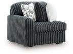 Gunmetal ribbed velvet corner chair with thick armrest and two throw pillows