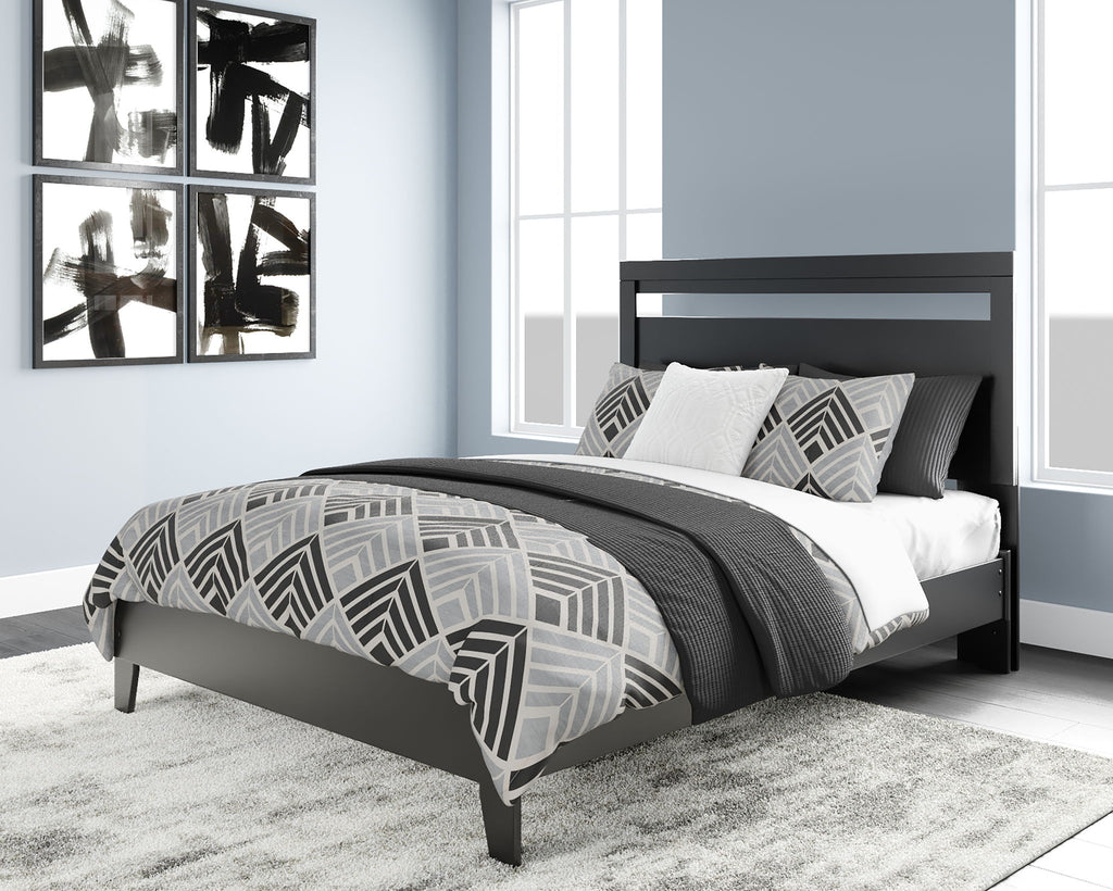 Finch panel platform bed in black with patterned duvet and pillows